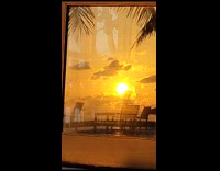 Seaside Sunset Reflection from Cottage Glass Window