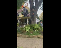 Woman drives by a house with Halloween decor