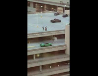 Couple on the parking lot with two men below photoshoot Part 1