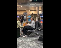 Woman tiktok dance video inside the airport