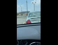 Girls laugh at parked taurus car 