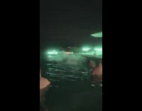 Woman in white dress jumps into pool