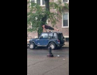 Man do push ups on jeep roof