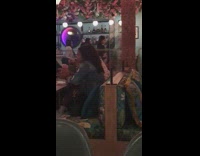 Three girls sit pose bar restaurant lanterns 