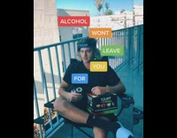 Guy sits balcony drinks truly hard seltzer 