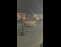 Guy rides and spins around the scissor lift