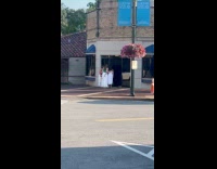 Women video shoot phone placed door handle