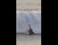 Guy riding surfboard crashes into other person 