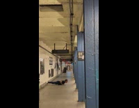 Guy does small pushups in station 