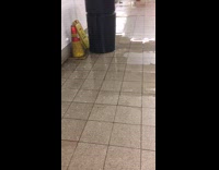 Drain pours out soapy water and floods subway station floor