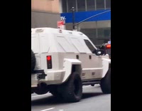 Large white truck with blocked out windows