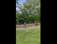 Guy wheelie bicycle missing front wheel park