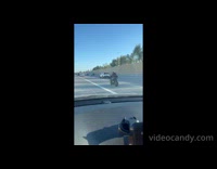 Man furry helmet dances while on motorcycle