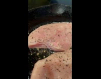 Chicken meat fried on pan moves breathes