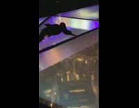 Girl lays glass floor black boots 