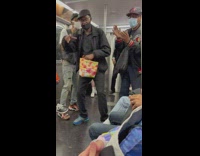 A cappella group of three sing on subway