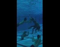 People swim underwater and play sport 
