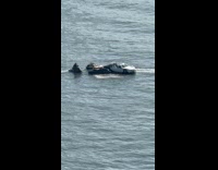 Boat customized as car with jet skis