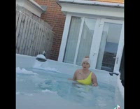Girl gets into pool water with ice 