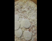 Guy make pizza with pepperoni as cheese 