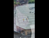 Brown jumpsuit girl dances yellow ball roof