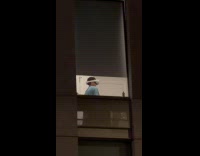 Boy wears VR goggles near the window