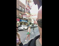 Girl takes photos alone using tripod 