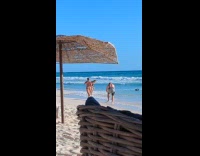 Woman beige bikini run for beach video