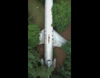 Couple lie down on top of airline at the forest