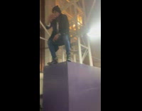 Guy records music video on cement block