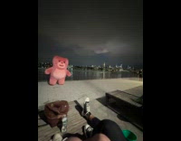 Collab WINY - Huge pink bear mascot walk sideways park