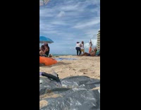 Guy dreadlocks white top rap beach snorkel 