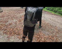 Guy on bike on dirt track hits bump and falls off
