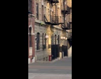 Woman pulls up bag from the window