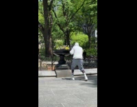 Man gray hoodie boxing weave practice park