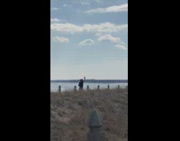 Woman black top sunglasses tiktok dance field