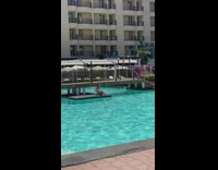 Girl sits grey platform pool bridge guy 