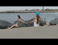 Collab IITW - Two groups take selfies by ocean rocks 