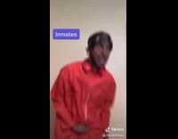 Prison orange jumpsuit white shirt guy ass