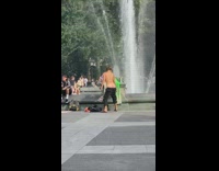 Man dances with butt crack out fountain
