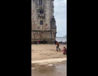 Man martial arts move near Belem tower