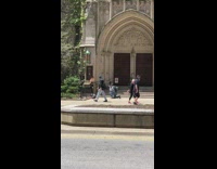 Brunette Poses with Legs Open in Lingerie Outside Church