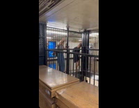 Women walk on fence to avoid subway flood
