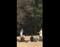 Man white shirt kick up camera stick