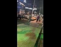 Robot wearing cowboy hat running on sidewalk