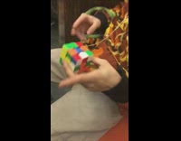 Collab WINY - Guy on train solves rubiks cube fast