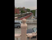 Guy leaves car unattended on bridge blocking a lane of traffic to pee 