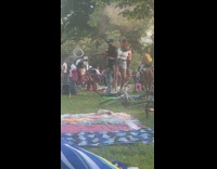 Man and woman tiktok with phone that spins around them