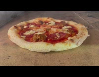 Pizza baking inside of an oven 
