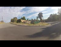 POV skateboard long board street fail runs into side walk grass